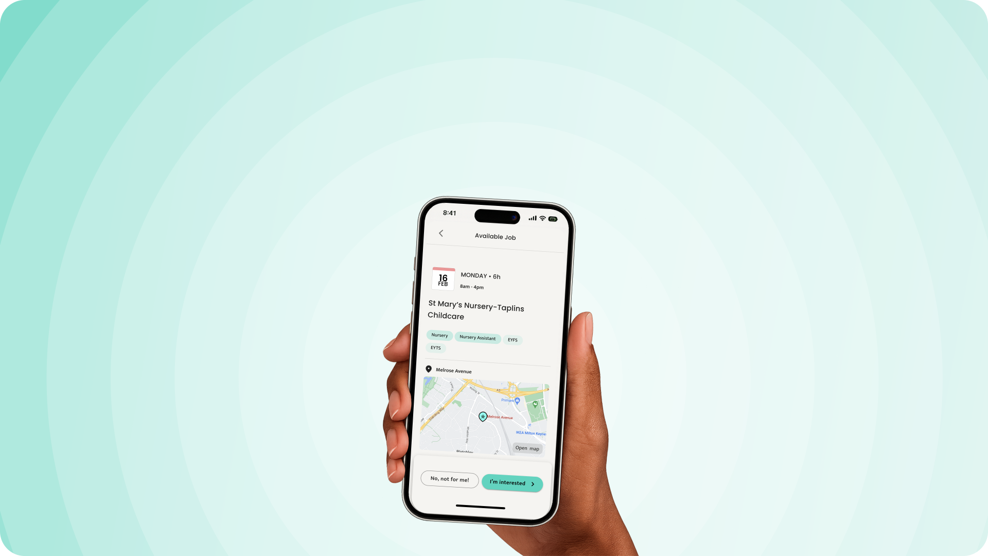 Humly app showing an available job on a phone held in a hand